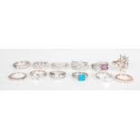 A selection of 12 stamped 925 silver ladies dress rings in a selection of styles, most set with cz's