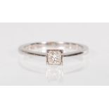 A stamped 950 platinum solitaire ring set with a square cut diamond. Diamond estimated 25pts. Weight