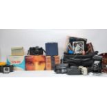 A collection of vintage 20th Century cameras and accessories to include 35mm cameras, boxed Ensign