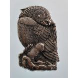 A silver plated vesta case in the form of a parrot holding a peanut in its claws. Measures 7cm tall.