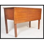 A retro mid 20th century teak wood  pembroke drop leaf gate leg dining table with single leaf raised