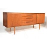 A retro 20th Century teak wood sideboard credenza, central bank of three drawers flanked by