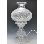 An unused large Waterford crystal two part table lamp with diamond and slice decoration, having a