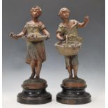 After Auguste Moreau ( 1822 - 1894 )  A pair of cast spelter figurines both raised on wooden
