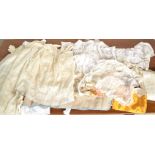 A collection of antique and vintage linens and clothing dating from the 19th Century onwards