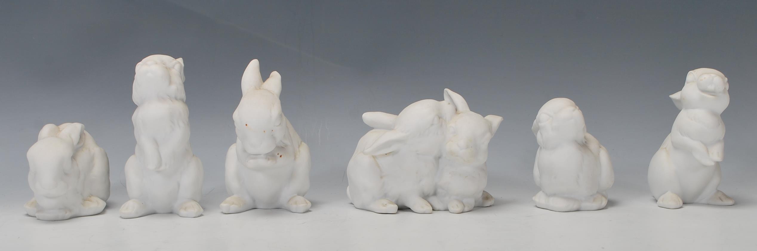 A group of six Kaiser porcelain figures in the form of rabbits in various positions, one being