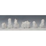 A group of six Kaiser porcelain figures in the form of rabbits in various positions, one being