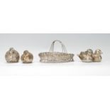 A group of four 20th Century silver plate salt and pepper condiments. Two in the form ducks and