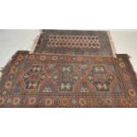An early 20th century Persian Qashqai floor rug having red ground with three central medallions with