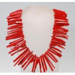 A 20th Century branch coral necklace of varying sizes of shards strung together having a lobster