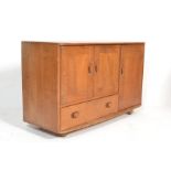 Ercol - Windsor - A 1960's retro vintage blonde beech and elm sideboard comprising of an arrangement