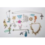 A collection of fashion jewellery pendants and brooches, most by Kirks Folly to include fairy and
