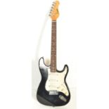 A vintage retro 20th century Encore stratocaster type electric guitar musical instrument. The shaped
