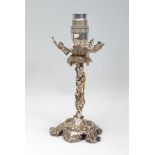 An Elkington & Co silver plated candlestick to lamp conversion in the form of a grape vine raised on