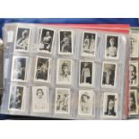 An album of mixed vintage 20th Century trade and collectors cards to include multiple series of