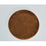 An 1884 full gold sovereign coin having George and the Dragon design with a Young Victoria head
