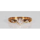 A hallmarked 9ct gold and diamond ring. The ring having a central diamond within a white and