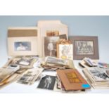 A collection of vintage photographs and postcards, postcards to include portrait, scenic, comic etc.