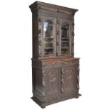 A 19th century impressive large Gothic oak carved large library bookcase cupboard. Raised on an
