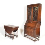 An early to mid 20th Century oak bureau bookcase, glazed doors to the top with shelved interior over