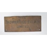 A vintage early 20th Century brass wall plaque of rectangular form with notation in bold letters