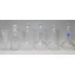 A group of four 19th Century Victorian cut glass decanters having bulbous form bodies with