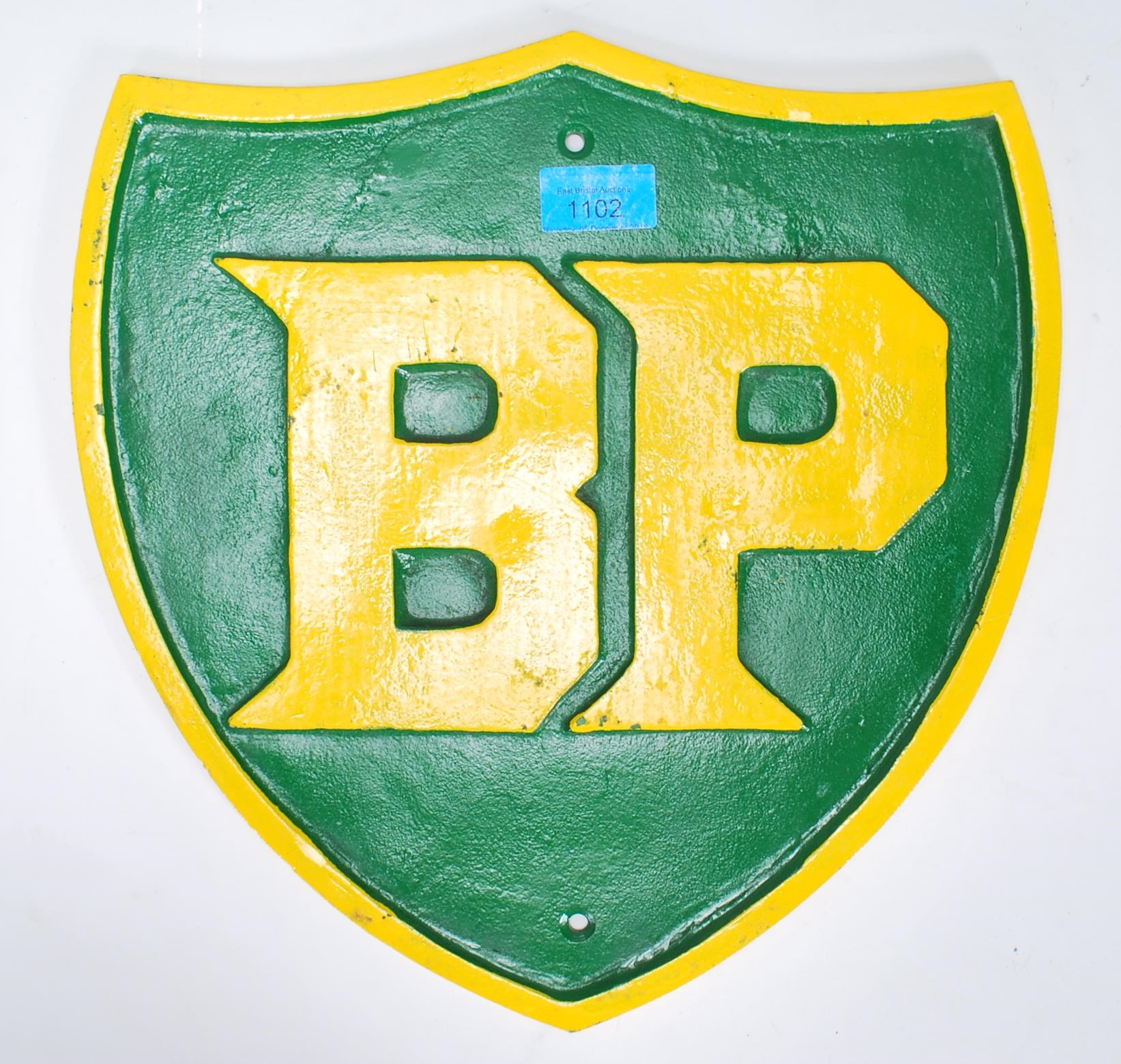 A vintage 20th Century cast iron BP reproduction advertising sign of shield form having a green