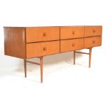 A retro 20th Century teak wood Danish inspired six drawer sideboard, having an arrangement of six