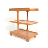 A mid century retro 3 tier graduating oak and pine butlers service trolley. Raised on castors with 3