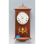 A contemporary 20th Century mahogany inlaid cased wall clock of small proportions by Knight and