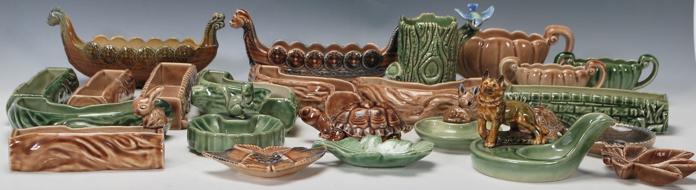 A collection of vintage 20th century Wade ceramics to include a green glazed pipe holder having an