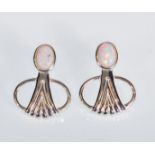 A pair of stamped Sterling silver Art Deco style stud earrings set with oval opal panels. Measures