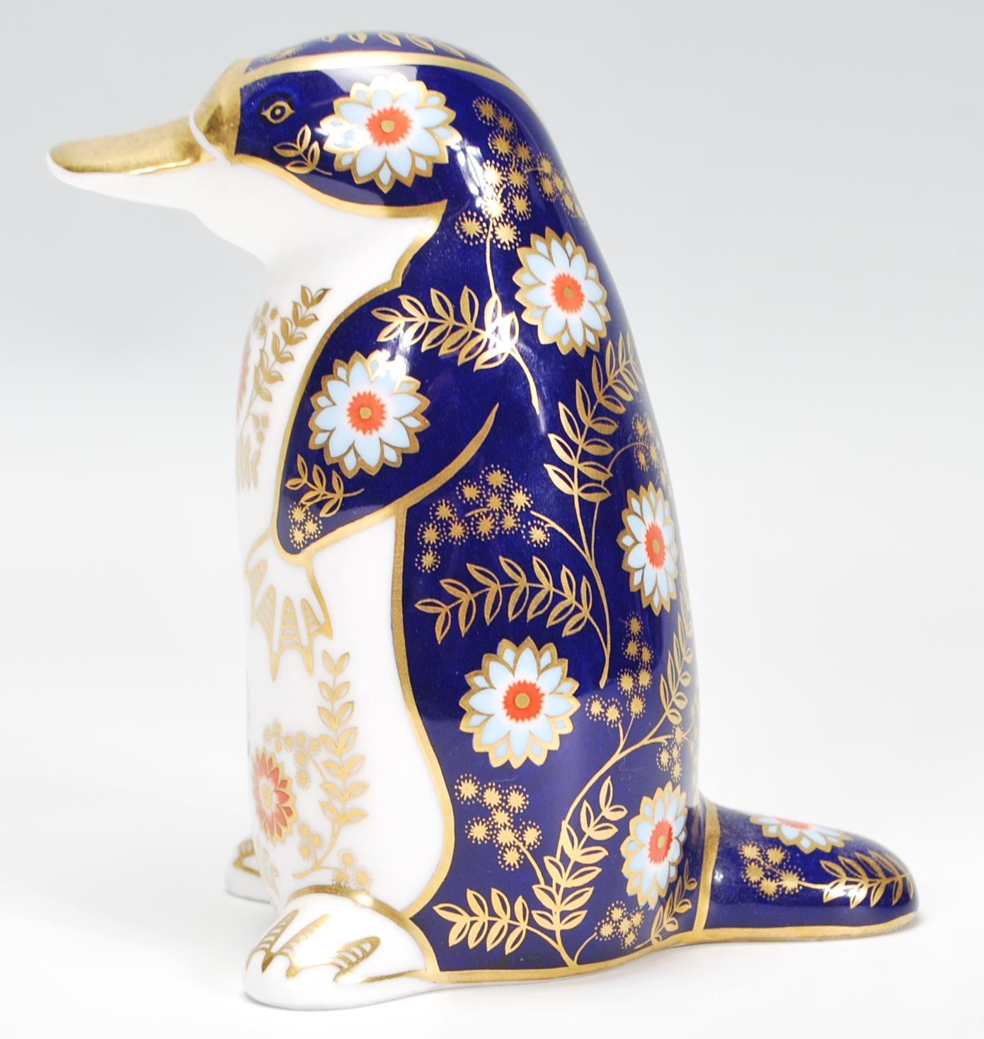 A Royal Crown Derby porcelain figurine of a Platypus in poly-chrome colourways, stamped to the - Image 4 of 6