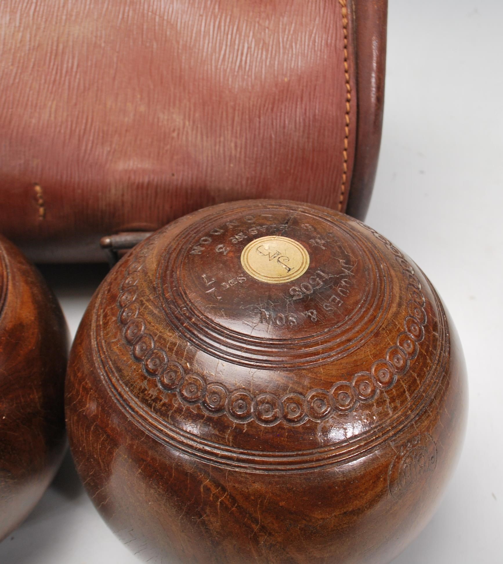 Crown Green Bowls - A set of three early 20th century vintage lignum vitae bowling bowls, in - Image 4 of 6