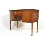 A 19th century Georgian mahogany bow small proportion sideboard raised on square tapering legs