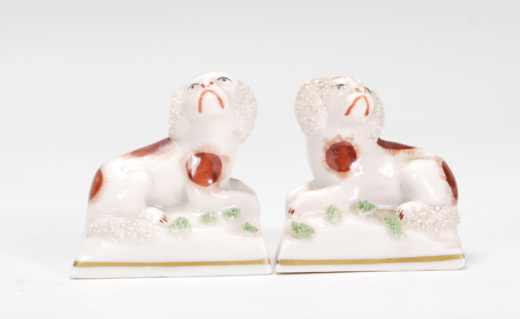 A pair of rare 19th Century Victorian Chelsea ceramic figurines in the form of King Charles Spaniels