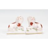 A pair of rare 19th Century Victorian Chelsea ceramic figurines in the form of King Charles Spaniels