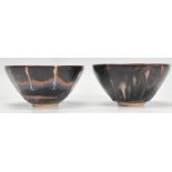 Two 19th Century Chinese earthenware tea bowls of tapering form each with dripped brown glaze,