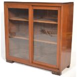 A mid century mahogany lawyers / barristers bookcase library cabinet. Raised on a plinth base with