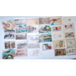 A collection of vintage postcards dating from the early 20th Century to include WWI silk postcards