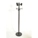 A contemporary sputnik atomic style ebonised metal hat / coat stand having a a round base, central