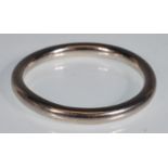 A stamped 925 silver bangle of typical form. Measures 6.6cm interior diameter. Weight 40.3g.