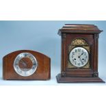 A group of three mantel clocks to include a mid 20th Century domed top mantel clock with a round