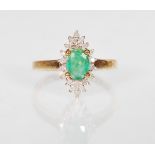 A 9ct gold hallmarked emerald and diamond cluster dress  ring, central mounted oval cut emerald