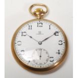 An early 20th century Omega  Watch Co Swiss open faced pocket watch. The gold plated case with screw