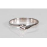 An English hallmarked 9ct white gold solitaire ring set with a round cut white stone in a