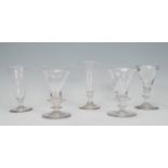 A harlequin set of Georign sherry / cordial glasses of tapering form to include two etched with