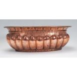 A 19th Century Victorian copper planter of ovular form having hammered repousse reeded sides, having