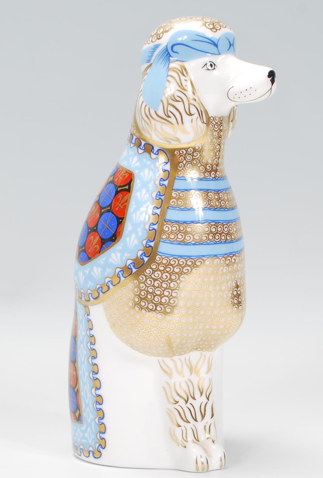 A Royal Crown Derby Porcelain figurine from the National Dogs series ' French Poodle ' Stamped to
