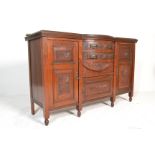 An Edwardian walnut bow front sideboard dresser. The wide body with central bow fronted section.